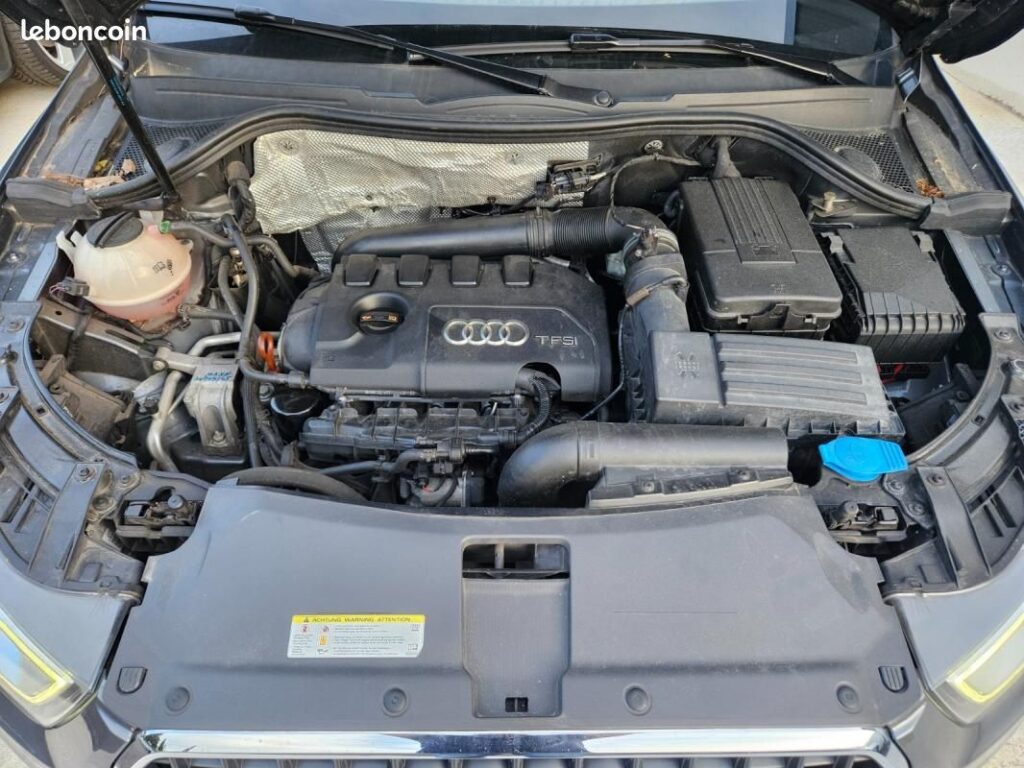 Photo de l’Audi Q3 quattro essence, modèle 2012, 101 000 km, à vendre chez SG Auto à Nîmes. SUV 5 places avec transmission intégral